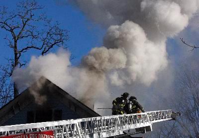 Firefighters Vent Roof From L35 At Strawberry Rd Fire On 12/17/09  Photo From The Journal News